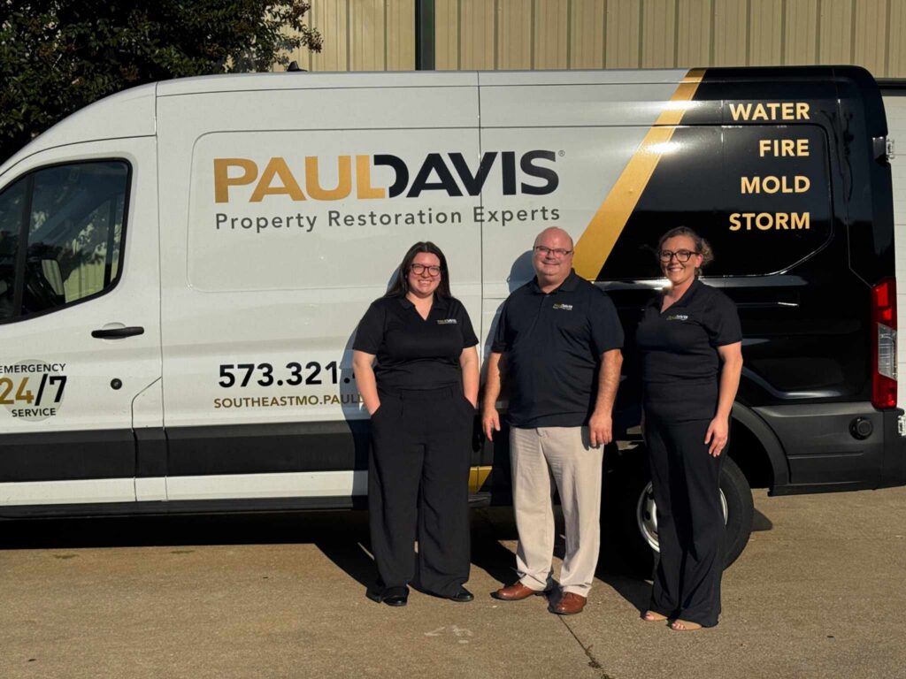 Paul Davis Restoration of Southeast MO, Carbondale & Paducah team standing in front of branded restoration service van offering water, fire, mold, and storm damage restoration services